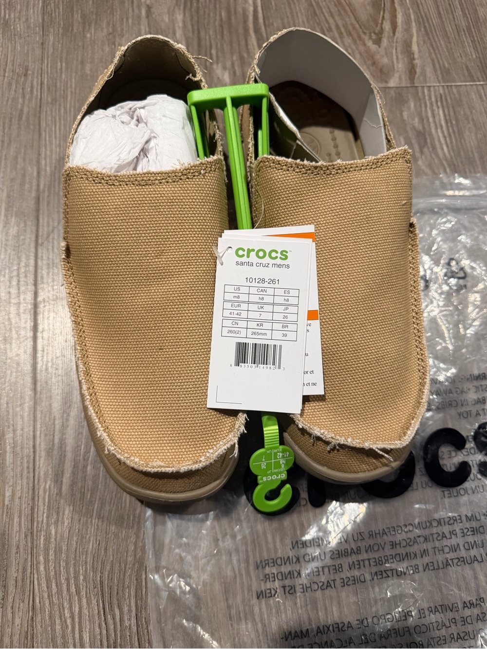 Crocs Santa Cruz Canvas Slip-On Shoes in Tan